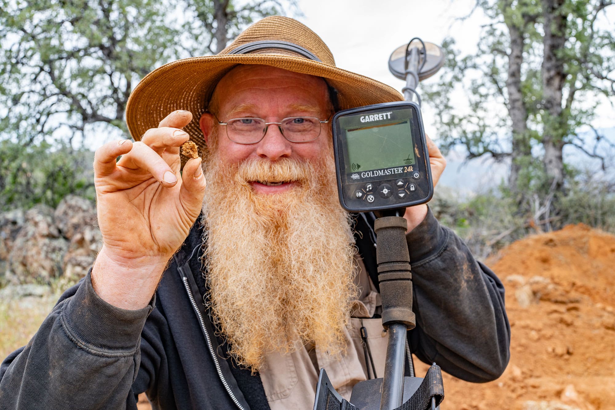 Goldmaster 24K user prospecting in rugged terrain