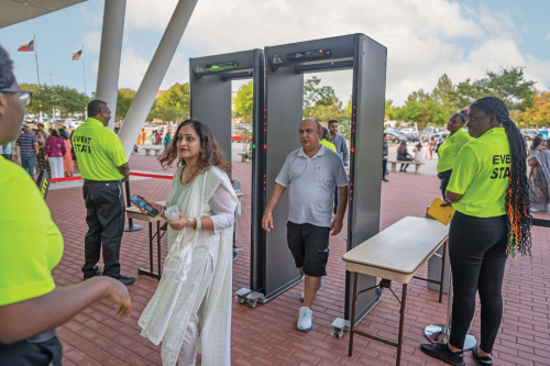 People passing through Paragon metal detector