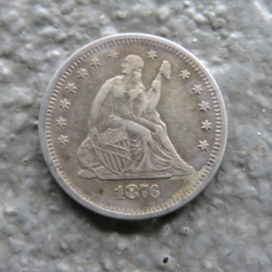 Moneda de 25 céntimos con Libertad sentada, de 1876, encontrada por Guy M.