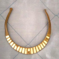 Torque necklace with mother of pearl or oyster shell inlays, found by Clark S.